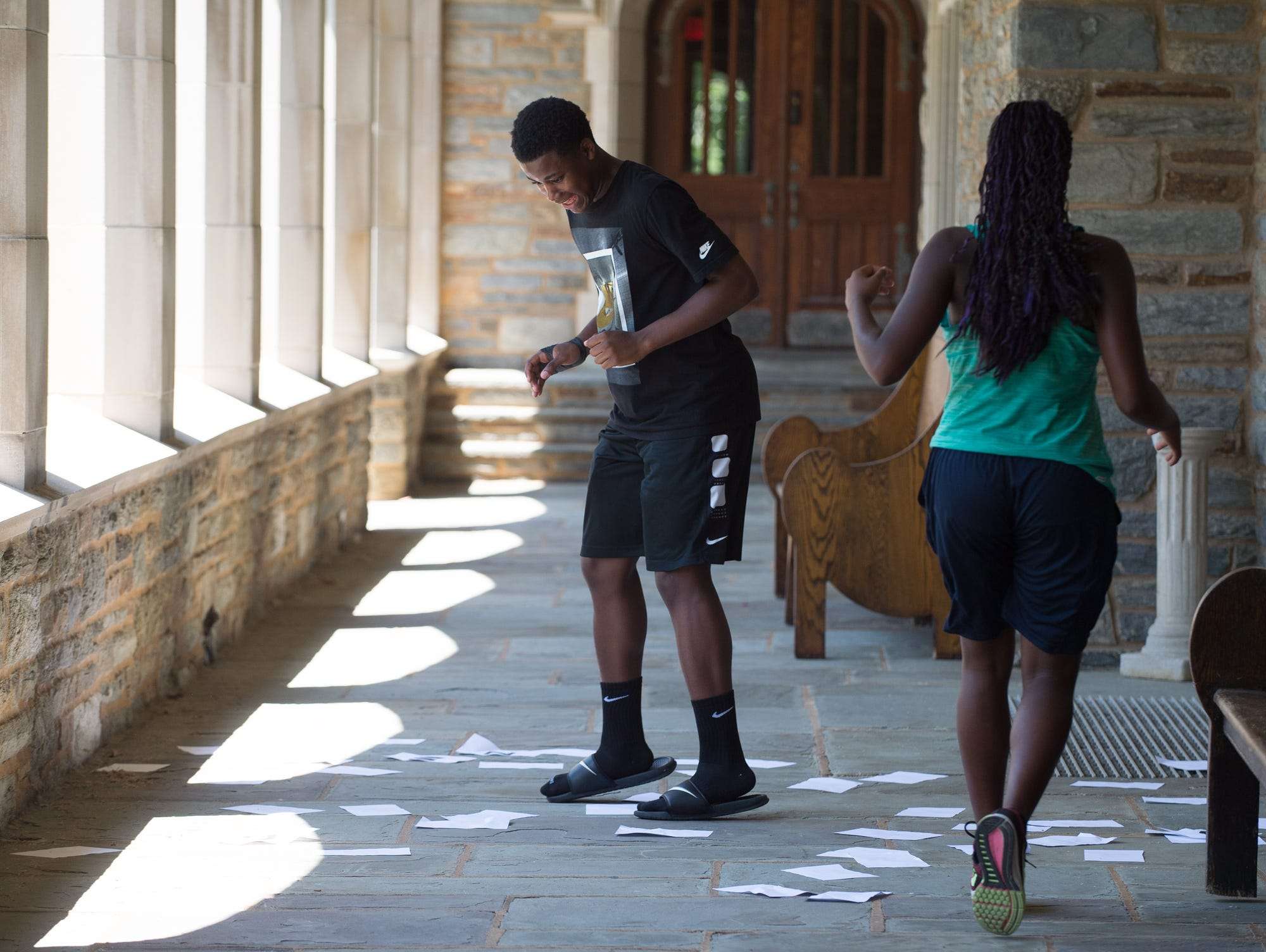 Jason White (14) of Philadelphia, Pa., participates in a team spelling challenge during a classroom session at the Strive Sports Challenge at St. Andrew's School in Middletown, Del,.
