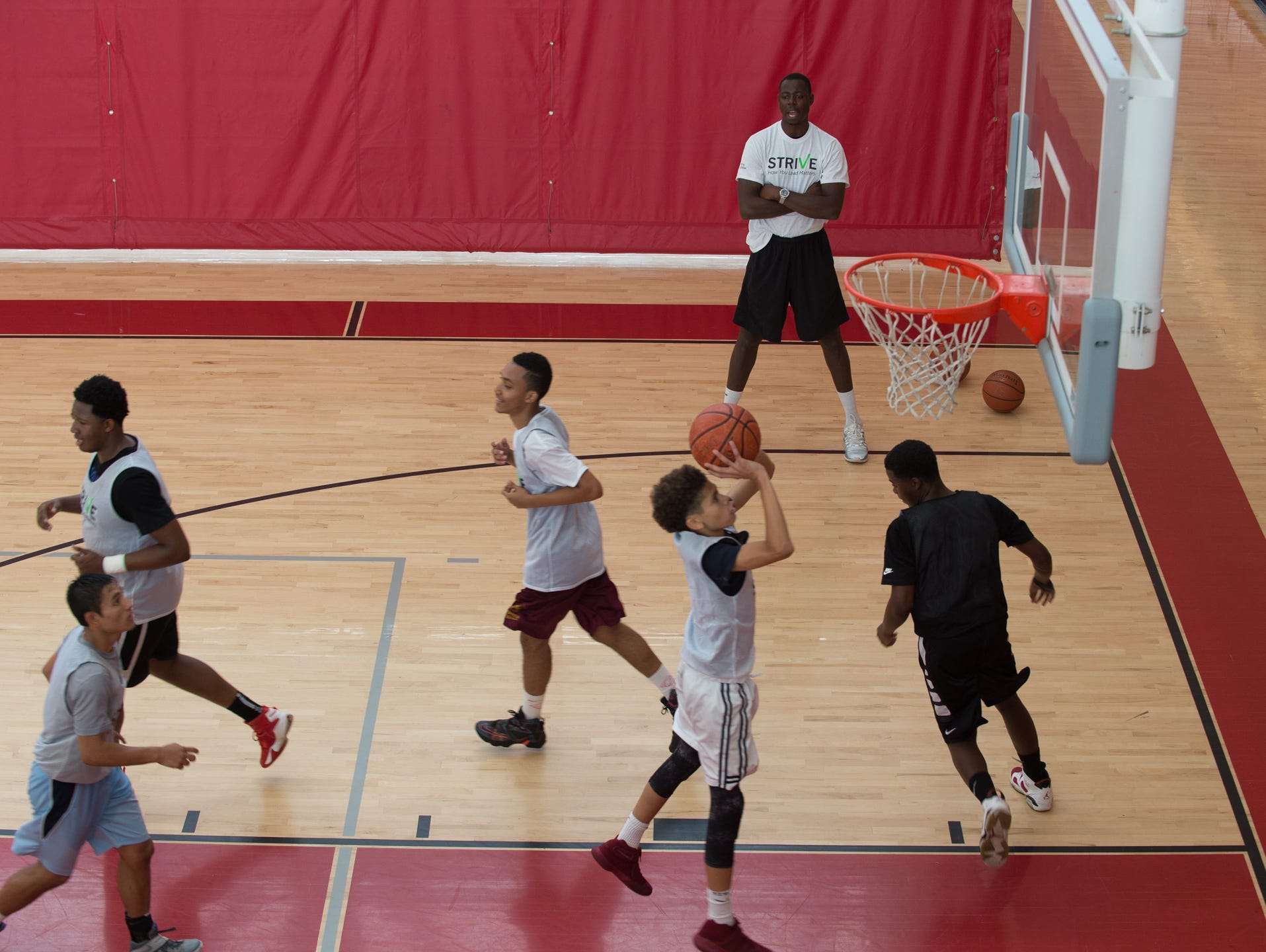 St. Andrew's School alumni, Eric Boateng, working with basketball players during the Strive Sports Challenge at St. Andrew's School in Middletown, Del,.