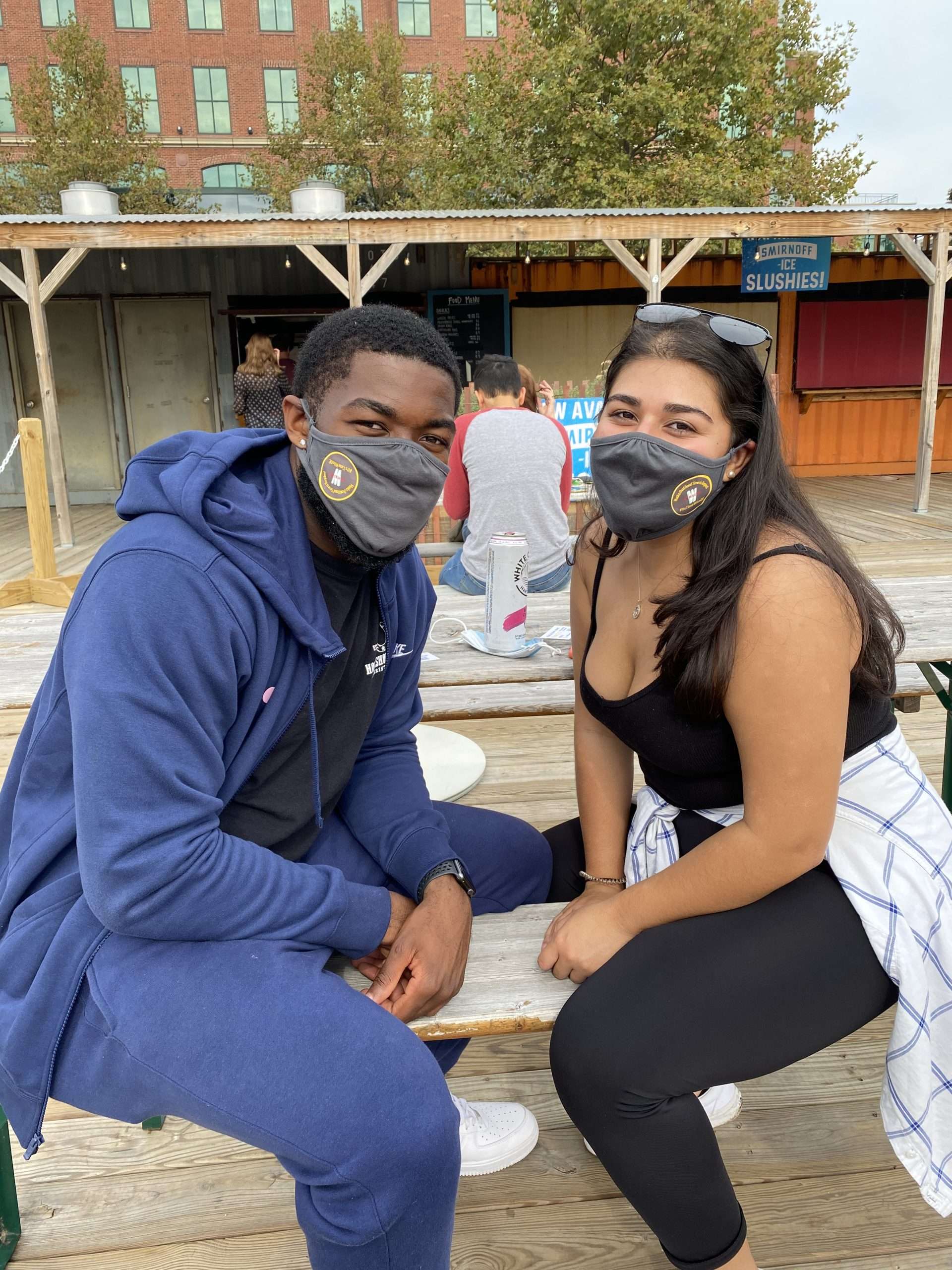 couple posing with masks