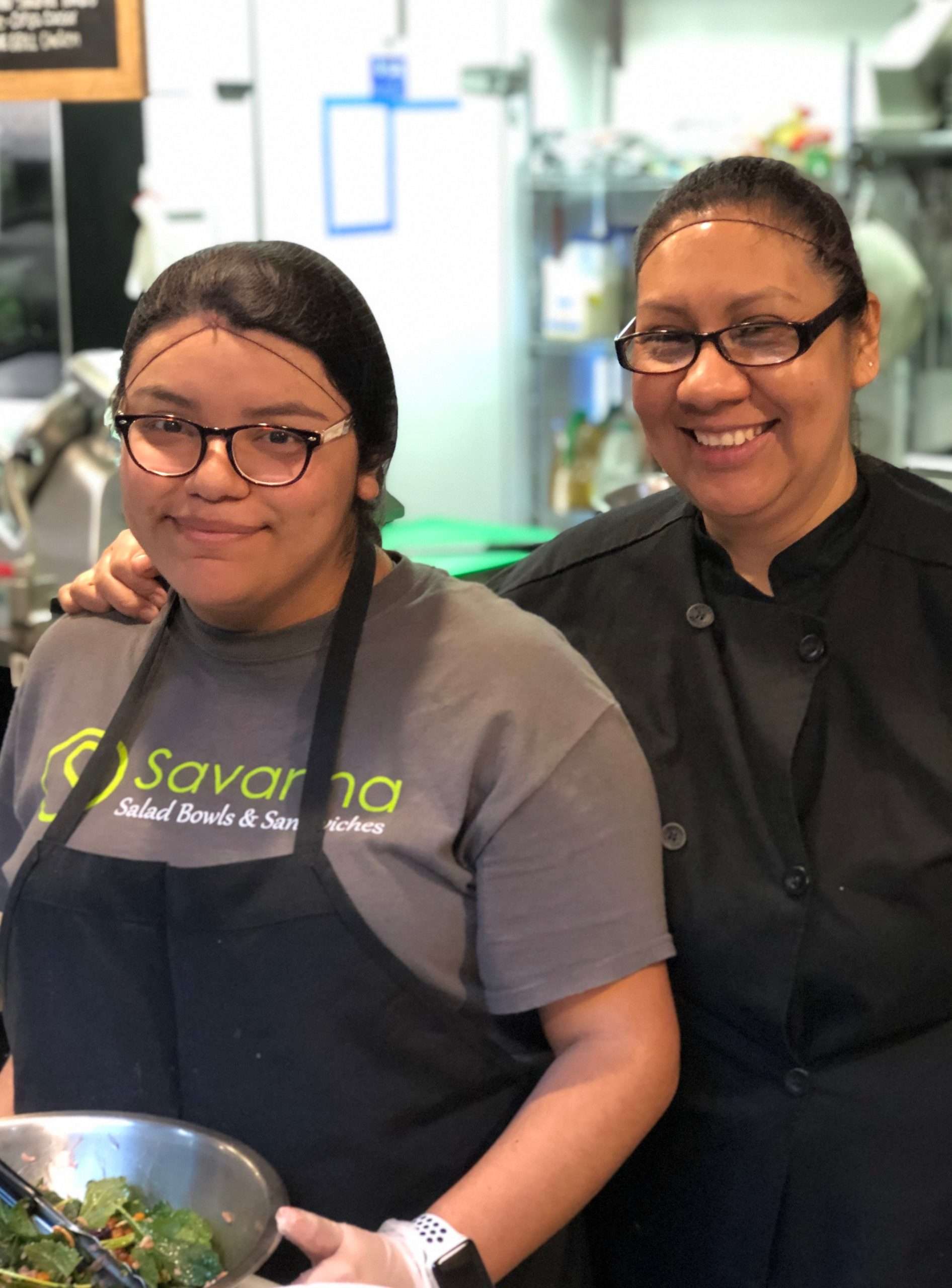 Mirta and Carla making lunch-time salads.